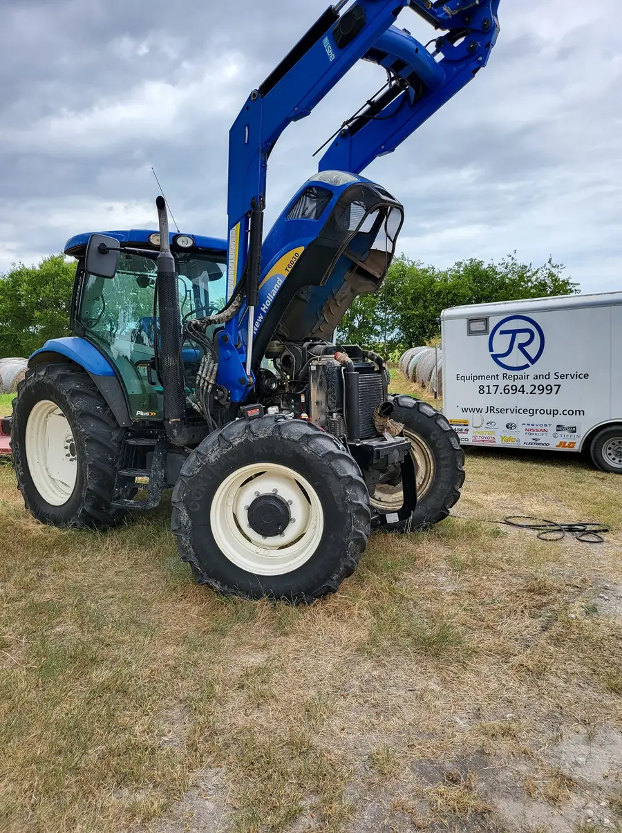 New Holland tractor being serviced by the JR Equipment Repair mobile fleet